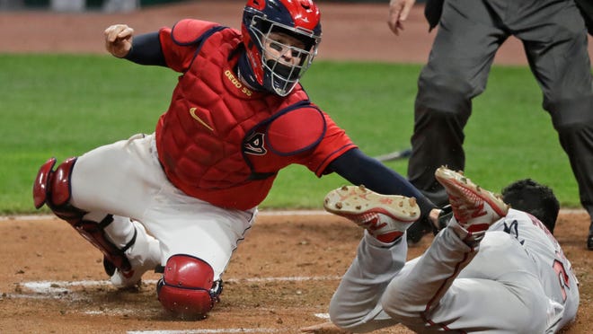 Minnesota Twins' Luis Arraez, right, is tagged out by Cleveland Indians' Roberto Perez in the fifth inning in a baseball game, Monday, Aug. 24, 2020, in Cleveland.