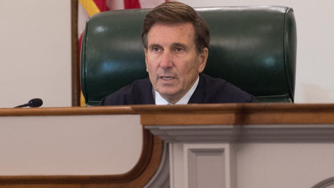 Delaware Supreme Court Justice Randy J. Holland asks a question during arguments over whether a lower court judge erred by ordering the Department of Correction to move defendant Isaiah McCoy out of solitary confinement. McCoy was convicted of first-degree murder and sentenced to death, before the Supreme Court overturned his conviction and ordered a retrial last year.