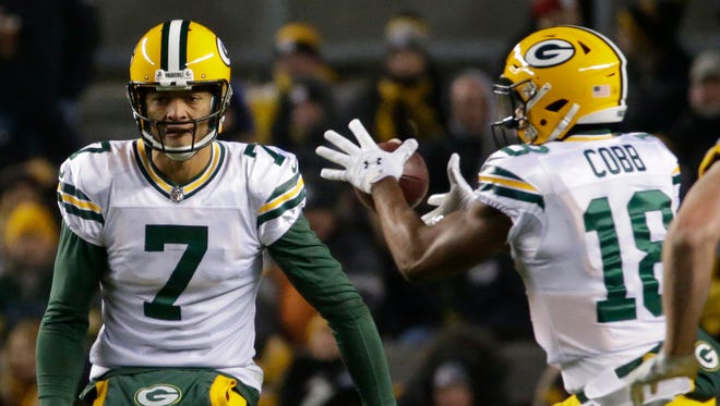 Green Bay Packers quarterback Brett Hundley (7) pitched the ball to wide receiver Randall Cobb (18) for one yard gain during the second quarter of their game Sunday, November 26, 2017 at Heinz Field in Pittsburgh, Pa.