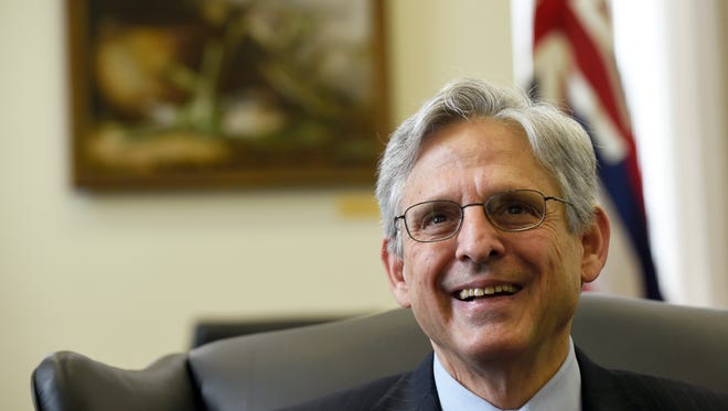 Supreme Court nominee Merrick Garland smiles on Capitol Hill in Washington.
