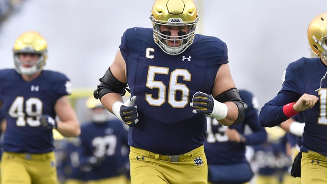 Nov 4, 2017; South Bend, IN, USA; Notre Dame Fighting Irish offensive lineman Quenton Nelson (56) runs onto the field for the game against the Wake Forest Demon Deacons at Notre Dame Stadium. Mandatory Credit: Matt Cashore-USA TODAY Sports