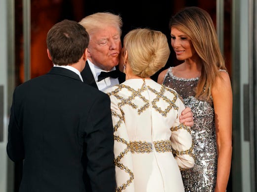 President Trump accompanied by first lady Melania greet