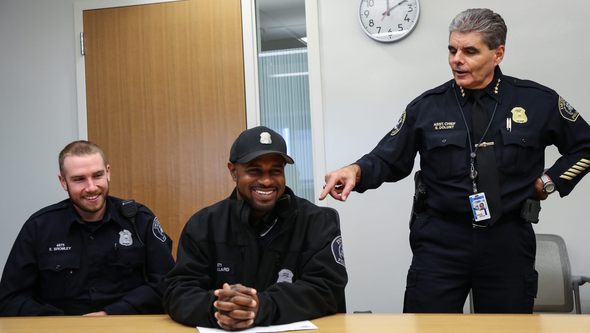 Detroit Police Asst. Chief Steve Dolunt (right) is not a fan of new policy change that allows women to wear earrings and for men to wear facial hair, like Detroit Police Officers Eric Bromley, of South Lyon (left)  and Richard Bullard, of Belleville.