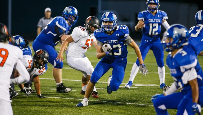 McNary's Lucas Garvey (23) carries the ball in a game against Sprague on Friday, Sept. 15, 2017, at McNary High School in Keizer, Ore. Sprague defeated McNary 62-6.