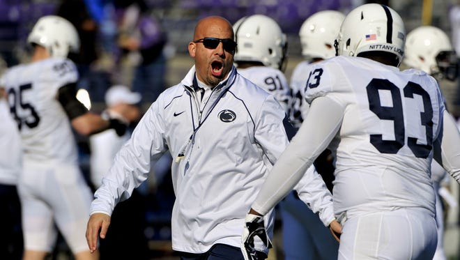 Penn State head coach James Franklin encourages players before  an NCAA college football game against Northwestern in Evanston, Ill.,  Saturday, Nov. 7, 2015.
