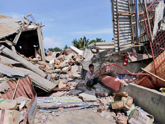 Indonesia earthquake kills at least 97 Indonesia earthquake kills at least 97