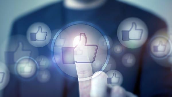 An illustrated "like" icon. A man in the...
