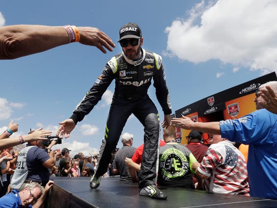 Jimmie Johnson greets fans before a NASCAR Sprint Cup