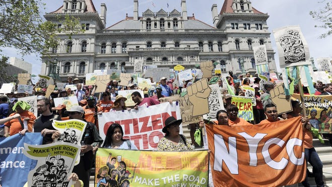 Environmental coalition groups rally Wednesday outside the state Capitol in Albany.