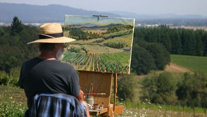 A participant in Artists in Action's series, Paint the Town, paints “en plein air” — French for “open air." The summer series provides a space for visual artists and poets to create new work at sites in and around Salem.