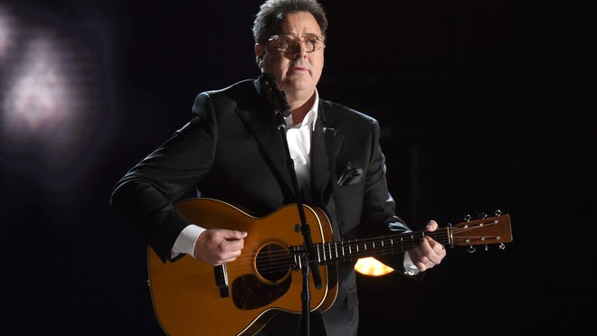 Vince Gill performs "Mama Tried" at the 50th annual CMA Awards at the Bridgestone Arena on Wednesday, Nov. 2, 2016, in Nashville, Tenn.
