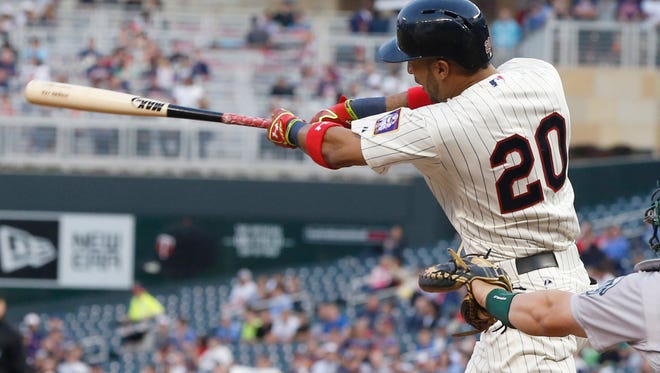Minnesota Twins' Eddie Rosario hits his first major league home run on the first pitch off Oakland Athletics pitcher Scott Kazmir in the third inning of a baseball game, Wednesday, May 6, 2015, in Minneapolis. (AP Photo/Jim Mone) ORG XMIT: MNJM103