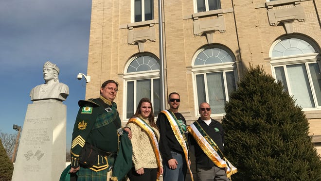 From left, Nutley resident Scott Sim; his daughter, Morgan Sim, who served as queen in the Nutley St. Patrick’s Day Parade; Frank Dauksis, Grand Marshal in that parade; and his chief of staff in the parade, Michael Cirelli, stand in front of the Irish flag raised at Belleville Town Hall during an Irish Heritage celebration on Monday, March 13, prior to St. Patrick’s Day.