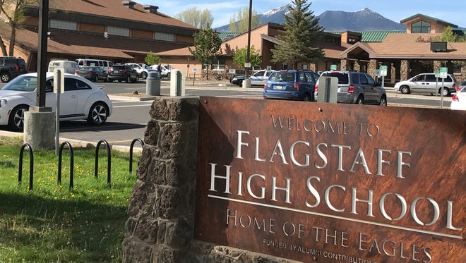 Police say they have arrested a student on suspicion of writing a threatening note against Flagstaff High School.
