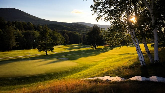The sun sets over the green at Dorset Field Club's par-5 seventh hole. The oldest course in America, Dorset is hosting the Vermont Amateur for the first time since 1912.