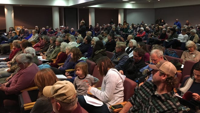 Over 250 people listen on at a Board of Zoning Appeals meeting in Verona, Va., on Thursday, Jan. 4, 2018, as the board considers whether to grant a special use permit to the Atlantic Coast Pipeline for a storage yard in Churchville, Va.