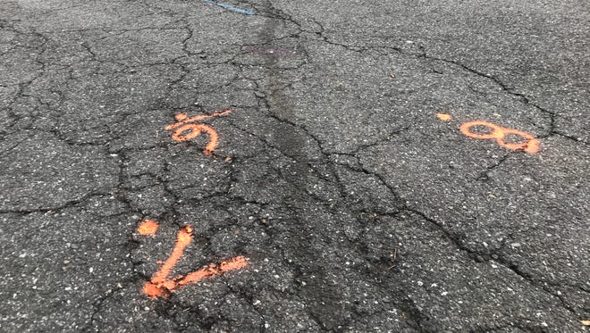 What is believed to a blood splotch at Catherine Court in Hillsdale, along with orange police investigation markings.
