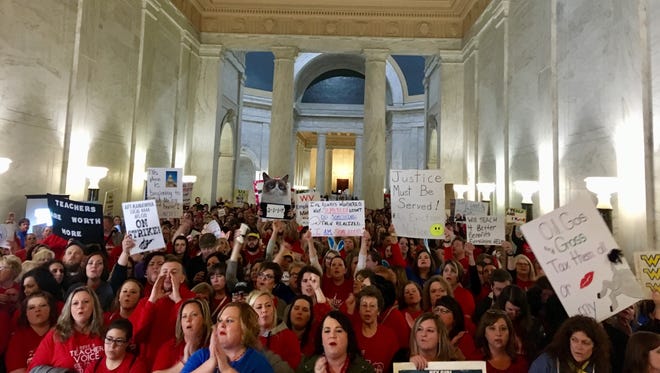 Thousands of teachers rally at the state Capitol in Charleston, W.Va., on Feb. 22, 2018. Teachers went on strike Thursday over pay and benefits.