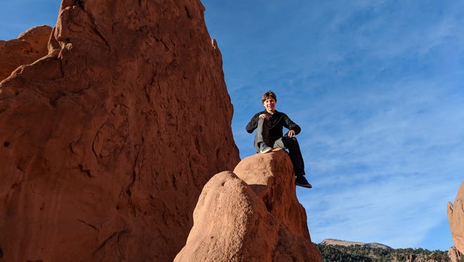 Iden Elliott scales the cliffs in the Garden of the Gods in Colorado Springs, Colorado. It looks scary, and it was.