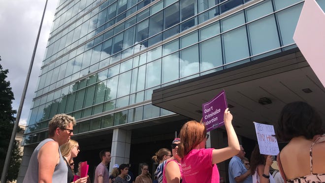 50 people rallied outside the Neal Smith Federal Building hoping to persuade Senators Joni Ernst and Chuck Grassley to vote against Trump's Supreme Court nominee Brett Kavanaugh.