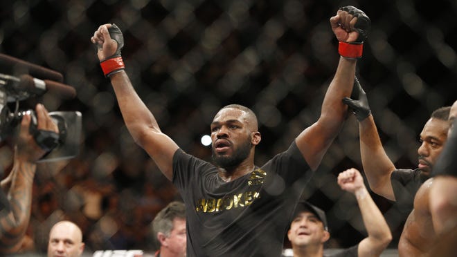 Jon Jones celebrates after defeating Daniel Cormier during their light heavyweight title bout at UFC 182 in January in Las Vegas.