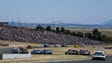 Drivers go through Turn 8 during the Toyota/Save Mart