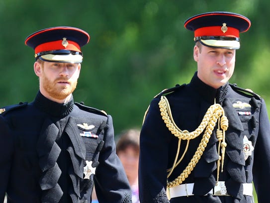 Prince Harry, left, arrives at his wedding to Meghan