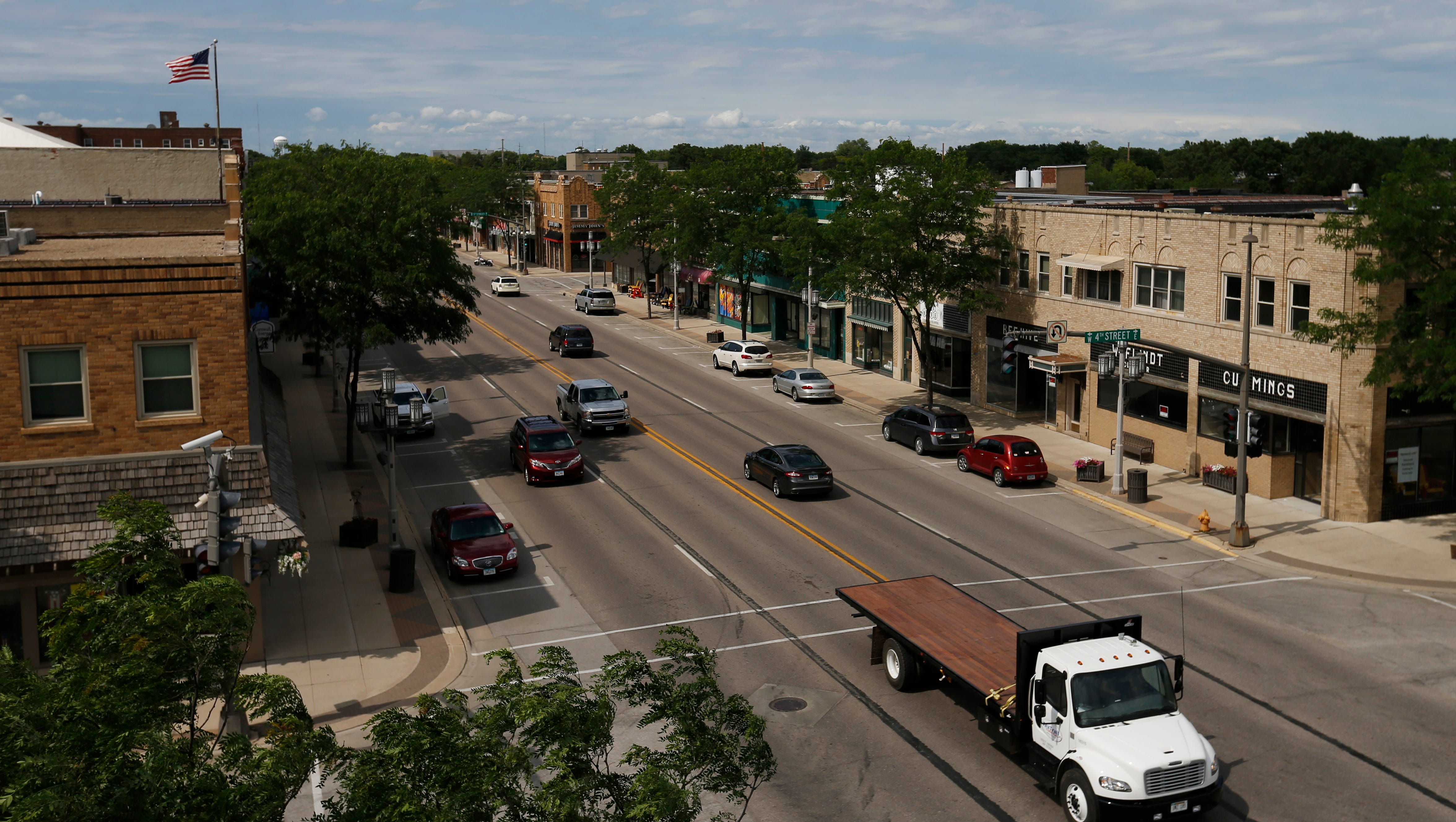 Traffic passes through downtown Spencer, Iowa, on Thursday, June 22, 2017. A fire in 1931 destroyed several downtown buildings.