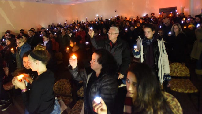 A candlelight vigil in Glen Rock on Saturday night bring out a crowd to acknowledge a recent bar shooting in Kansas that killed an Indian man and wounded another and is being investigated as a hate crime.
