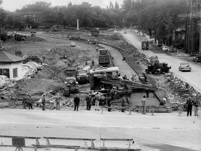 Path of Progress - Workmen put concrete-pouring machine