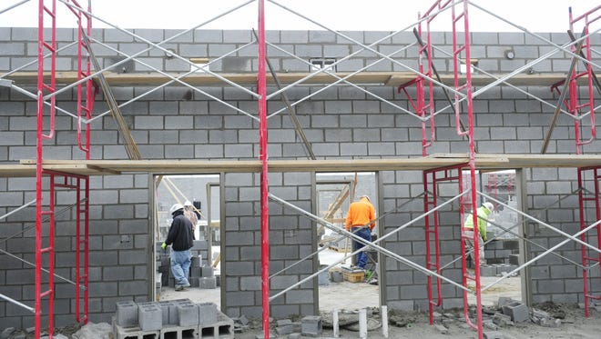 Workers build the first floor at Nolensville High School in January 2015.