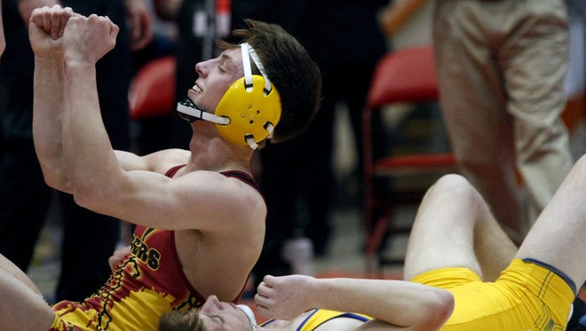 Roosevelt's Carter Lohr (left) celebrates after defeating West Central's Austin Ideker for the 138-pound championship at the Class A state wrestling tournament in Rapid City.