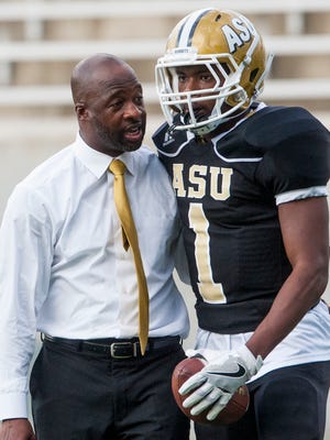 Alabama State football coach Brian Jenkins talks with Josh Davis before the Texas Southern game in Montgomery, Ala., on Saturday September 24, 2016.