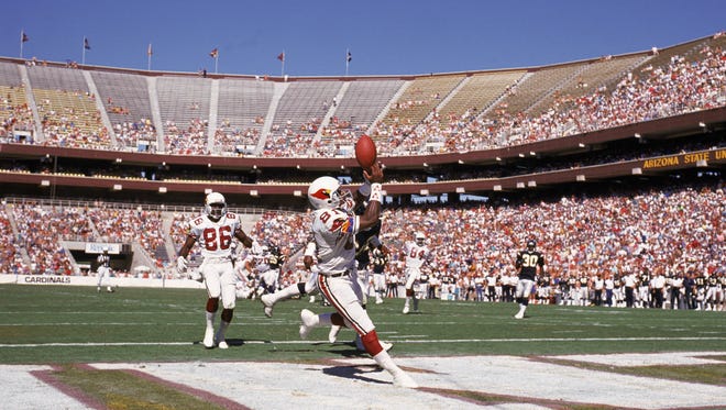 Roy Green of the Phoenix Cardinals catches a touchdown pass against the San Diego Chargers on Oct. 1, 1989 at Sun Devil Stadium.