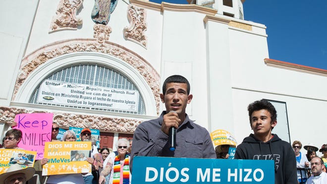 Jefferson Taborda, left, and his younger brother Steven Taborda talk on the steps of Our Lady of Health Catholic Church Thursday, May 18, 2017 about their mother, Francia Benitez-Castaño, a Las Cruces resident that was detained by U.S. Immigration and Customs Enforcement earlier this month. During the rally speakers asked the deputy director to of ICE to release her.