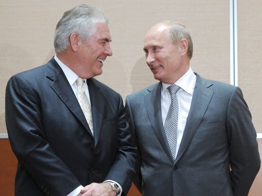 Tillerson speaks with Putin during the signing of a
