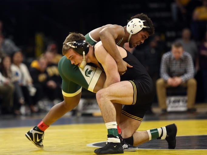 Iowa's Brandon Sorensen wrestles Michigan State's Jwan