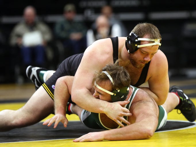 Iowa heavyweight Sam Stoll wrestles Michigan State's
