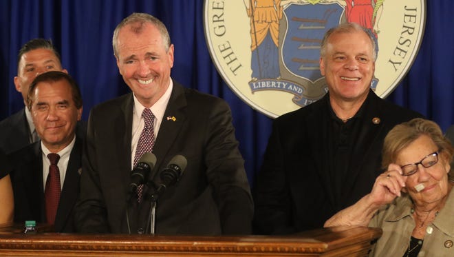 Assembly Majority Leader, Louis Greenwald, Assembly Speaker Craig Coughlin, Governor Phil Murphy and Senator Loretta Weinberg at the announcement of a budget deal.