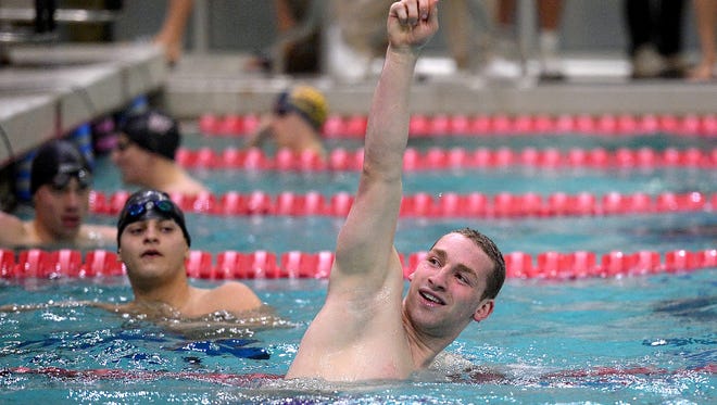 Brighton's Noah Stevens celebrates winning the finals of the 100-yard butterfly.