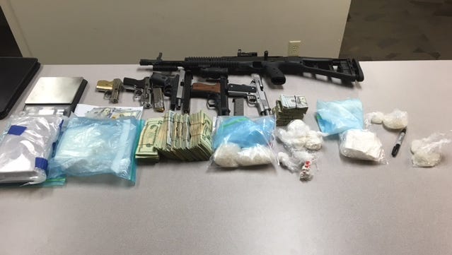 Two kilos of cocaine, a pound of methamphetamine, $25,000 in cash, five pistols and an assault weapon were seized in a federal drug bust in Bessemer, Ala.