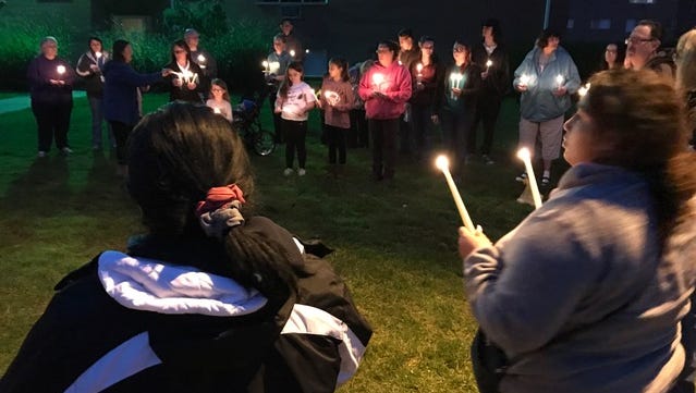 Dozens of people gathered at an apartment complex to mourn for a 5-year-old girl who died there the night before.