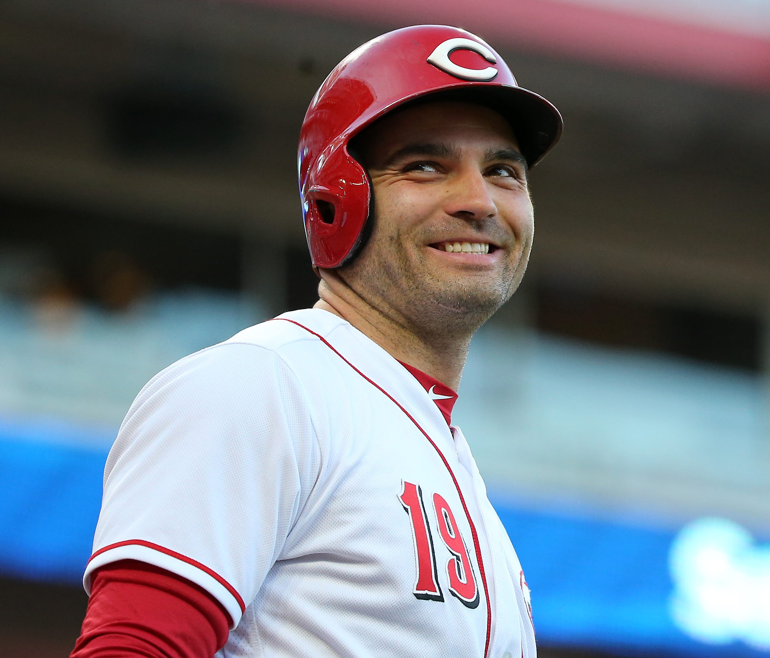 Cincinnati Reds first baseman Joey Votto (19) smiles to the fans while in the on-deck circle in the first inning during a National League baseball game between the Milwaukee Brewers and the Cincinnati Reds, Tuesday, May 1, 2018, at Great American Bal