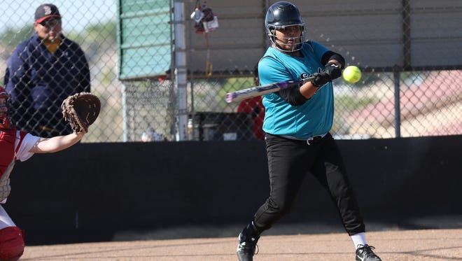 Navajo Prep's Taylor Yazzie hits a single against Estancia during the A/3A state tournament on Wednesday in Rio Rancho.