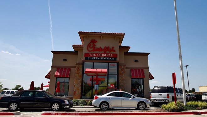 FILE -- Chick-fil-A launched a new mobile app Wednesday. To celebrate, the chain is giving away free chicken sandwiches.