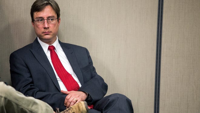 Buncombe County Assistant District Attorney Rodney Hasty listens during a Friday afternoon press conference about the homicides of J.T. and Christie Codd, of Leicester, at the Buncombe County Sheriff's satellite office on New Leicester Highway, March 20, 2015. The search warrants provided stated Robert Jason Owens, the charged in the case, admitted to storing and disposing of the bodies. 