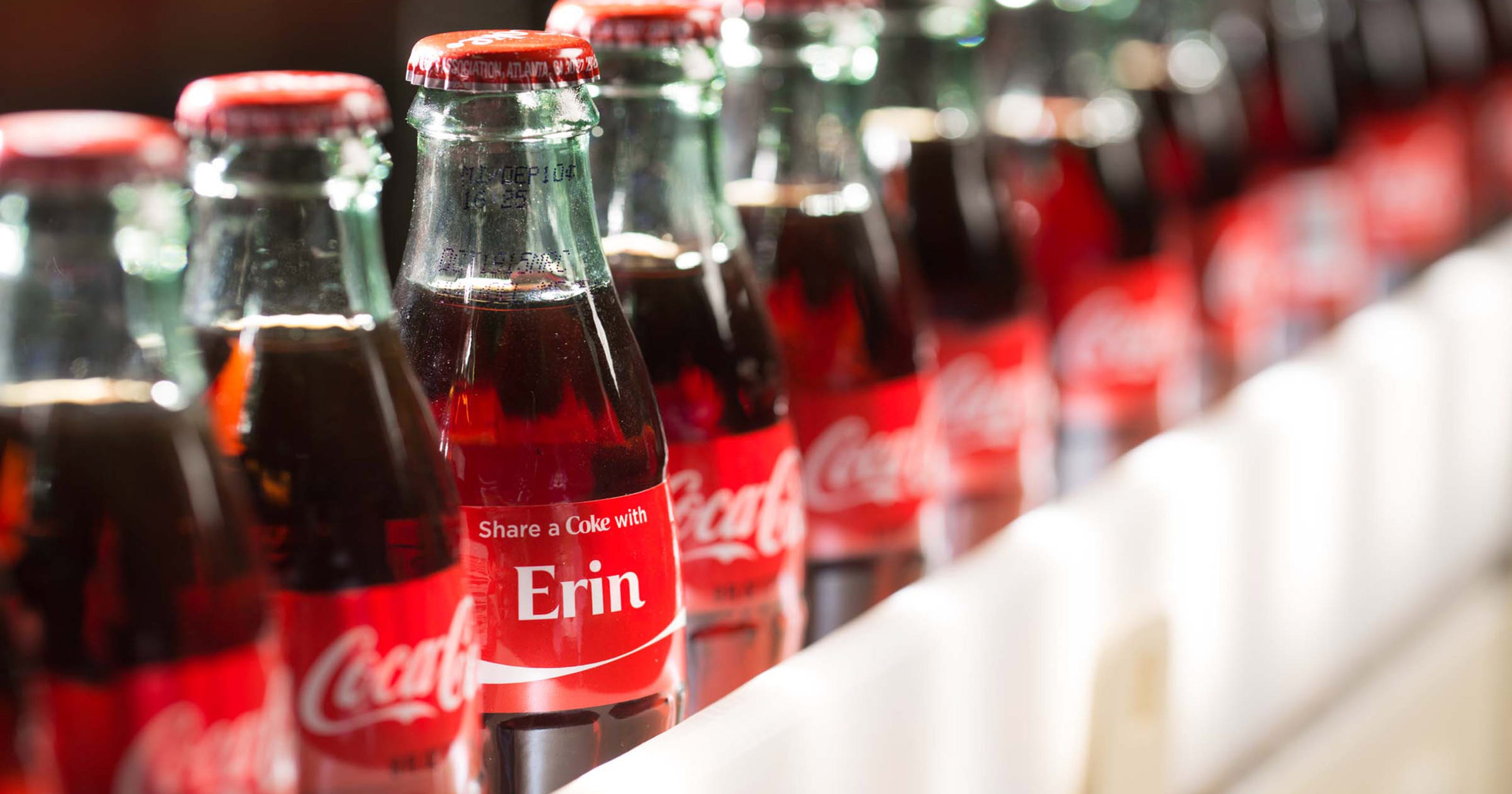 Coke bottles with first names return