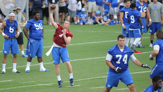 Redshirt freshman QB Drew Barker throws a pass during the University of Kentucky Football fan day at the Nutter Field House in Lexington, Ky., on Saturday August 8, 2015. Photo by Mike Weaver