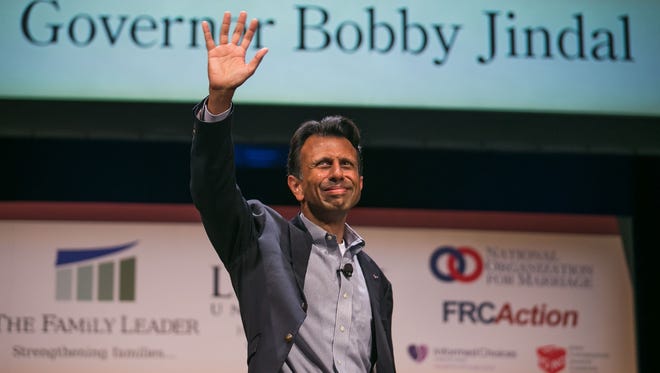 Governor Bobby Jindal waves to the crowd at Stephens Auditorium at the Family Leadership Summit in Ames on Saturday, July 18, 2015. 