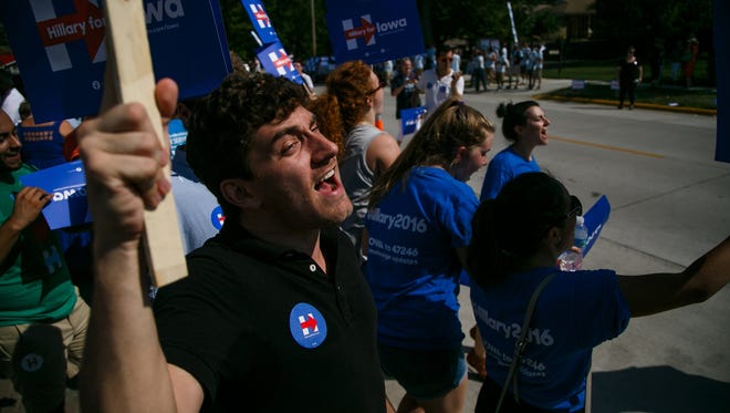 Hillary Clinton supporters including Kyle McGlade 21 of Council Bluffs, left cheer outside the Surf Ballroom in Clear Lake, IA before the Iowa Wing Ding on Friday, August 14, 2015.